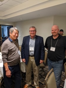 Darryl Tateishi, Randy Garvert and Danny Rowe enjoy the reception in Toronto.