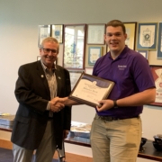 IMEF President Randy Garvert (left) presents the IMEF Distinguished Professors’ Scholarship to Brenden Meeks during a recent Milling Science Club meeting at Kansas State University.